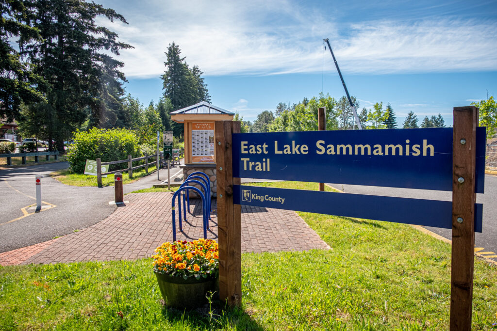 A sign that says "East Lake Sammamish Trail"