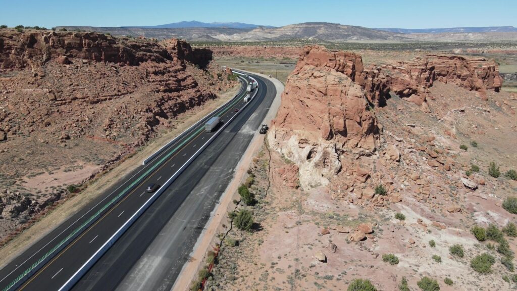 A road winds through a desert canyon