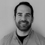 A black and white headshot of Reed McDonald