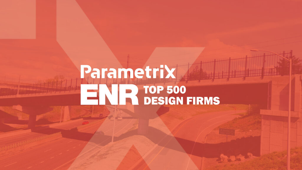 A red background with an image of a bridge with the text "Parametrix ENR Top 500 Design Firms"
