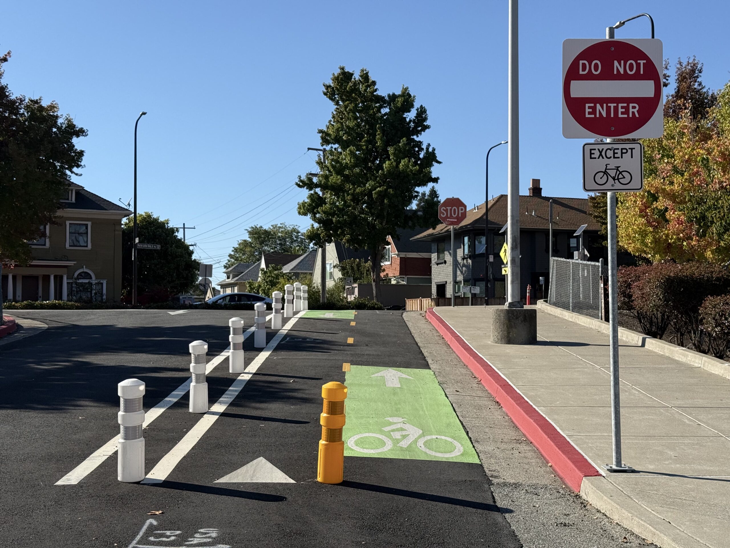 A bike lane going uphill with a do not enter sign
