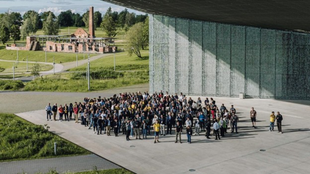 A bird's eye view of a group of people standing in front of a building