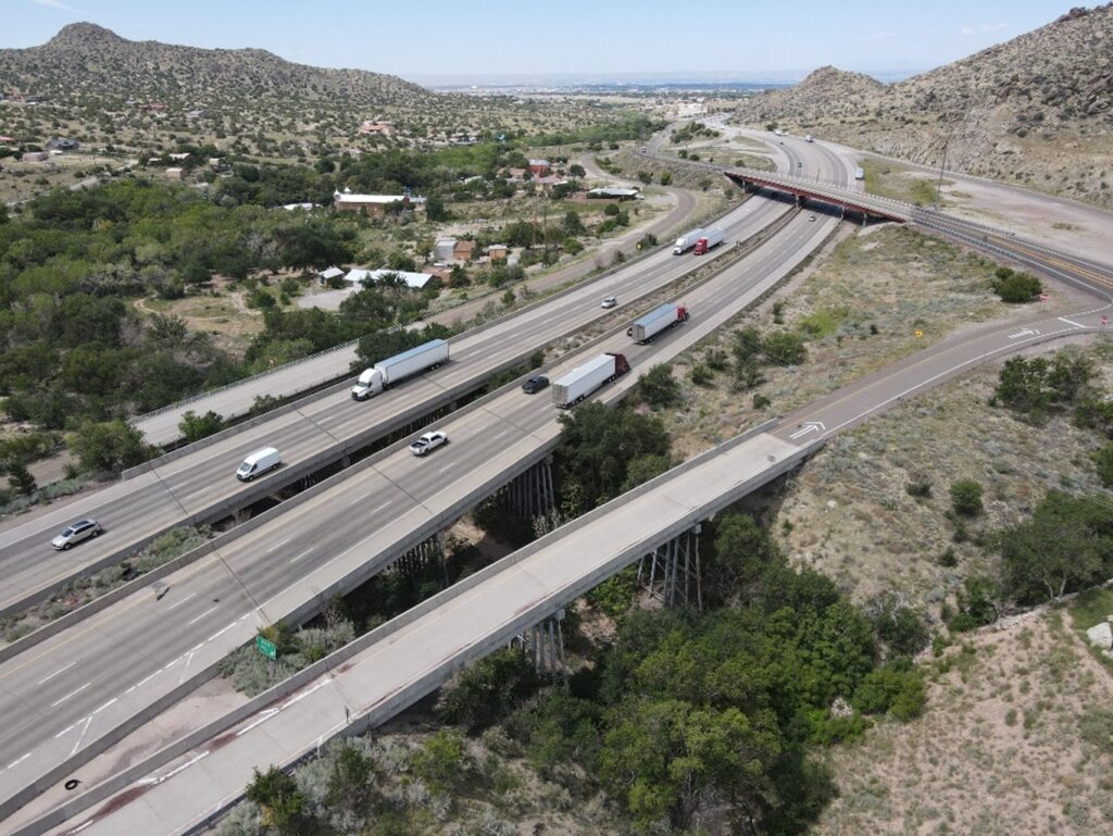 A bird's eye view of four bridges crossing a narrow canyon