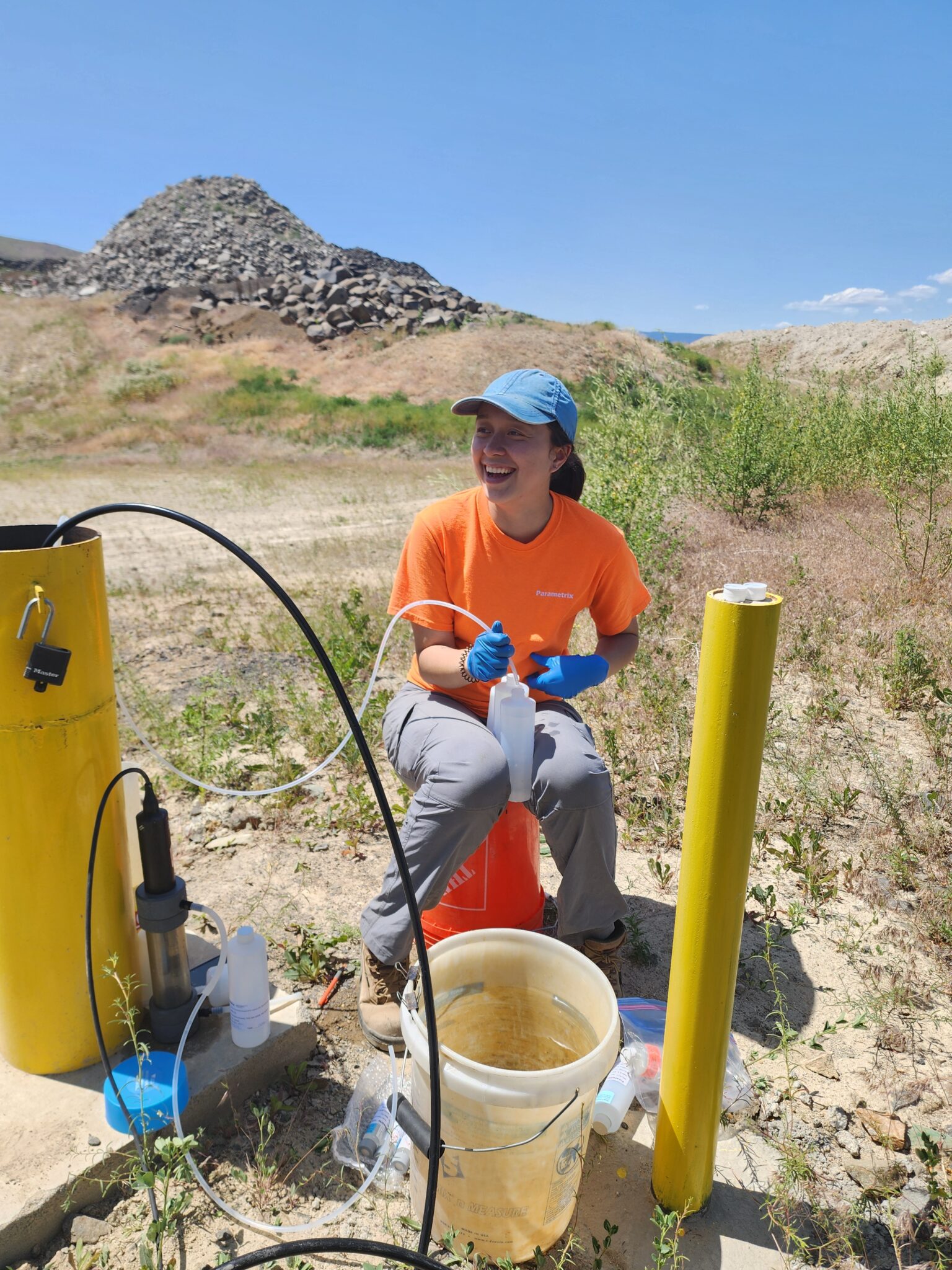 A person holding a tube for groundwater sampling.